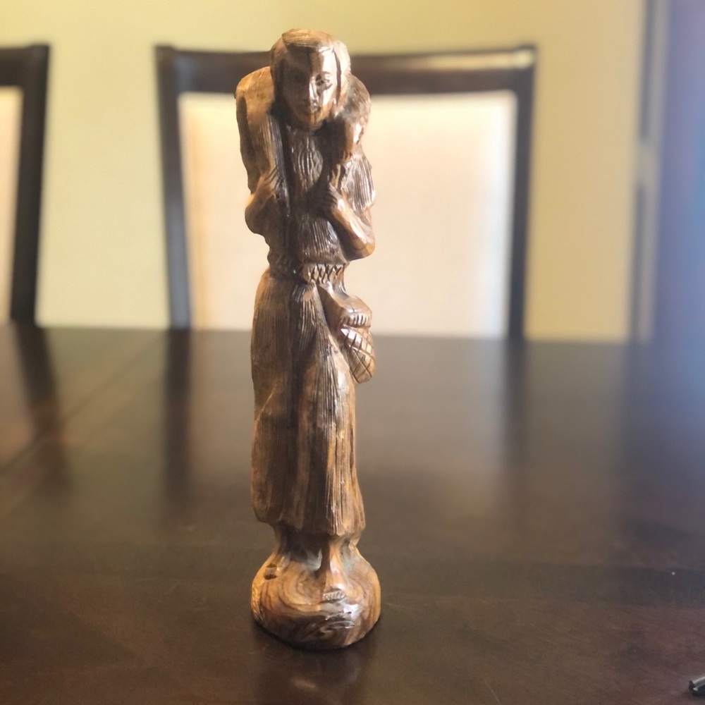 Hand carved wood Shepherd with lamb on shoulder